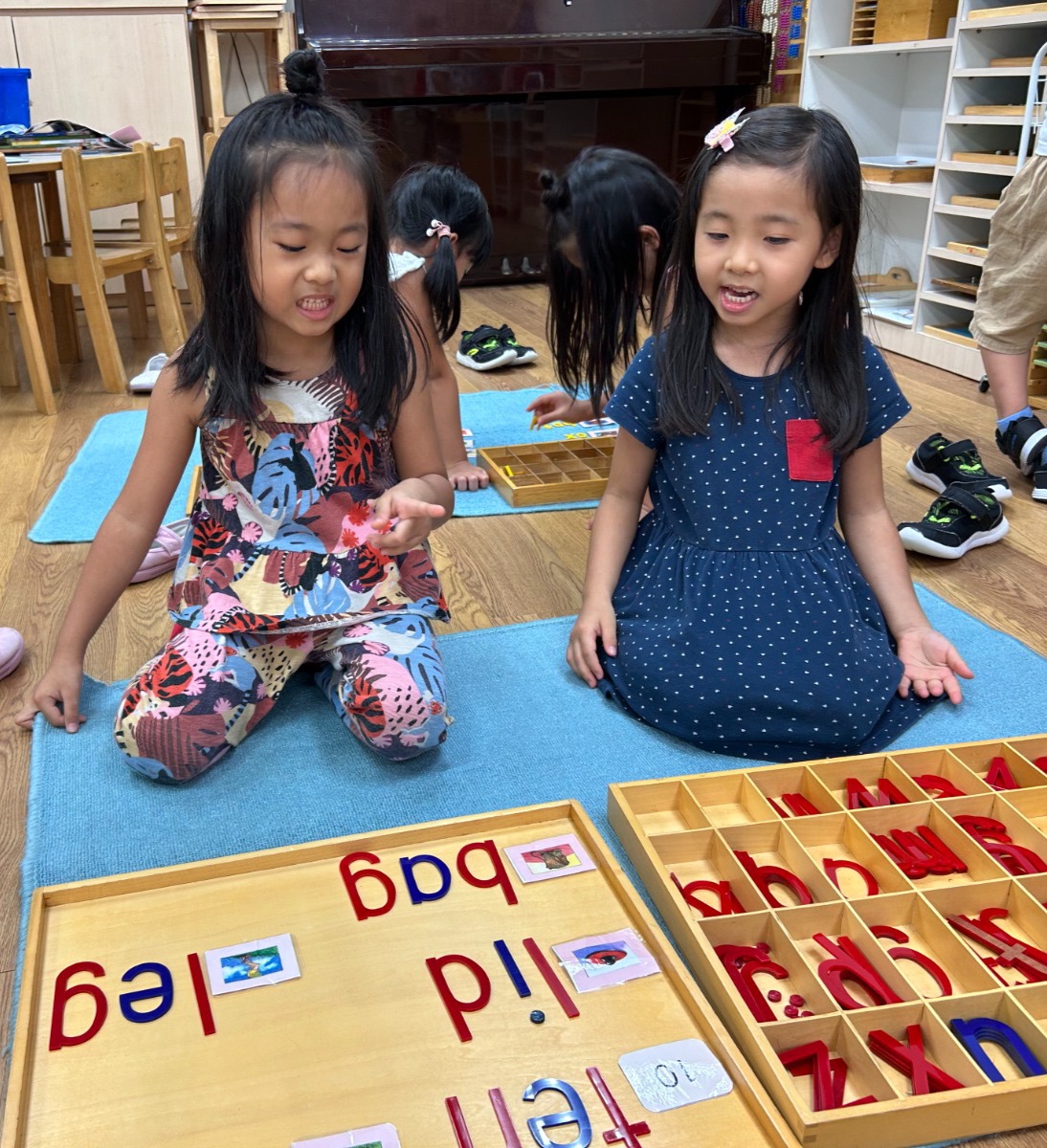 Children tracing sandpaper letters